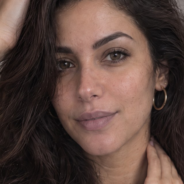 The same portrait up close: pores and freckles on the cheek and nose